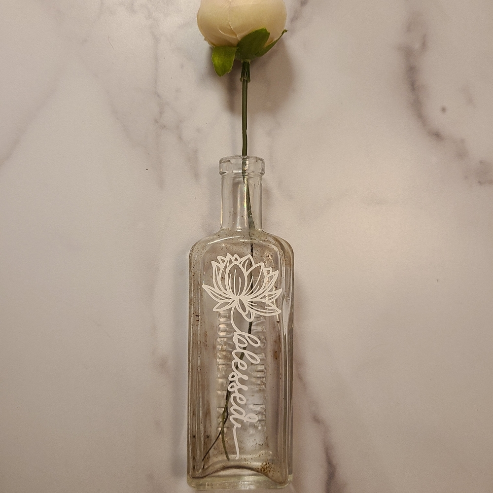 Antique bottle with vinyl art